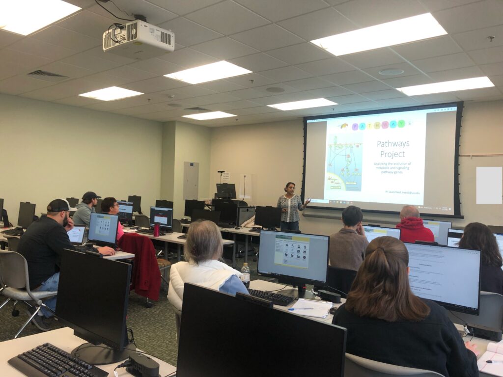 Trainer Indi Bose provides an introduction to the Pathways Project on via projector